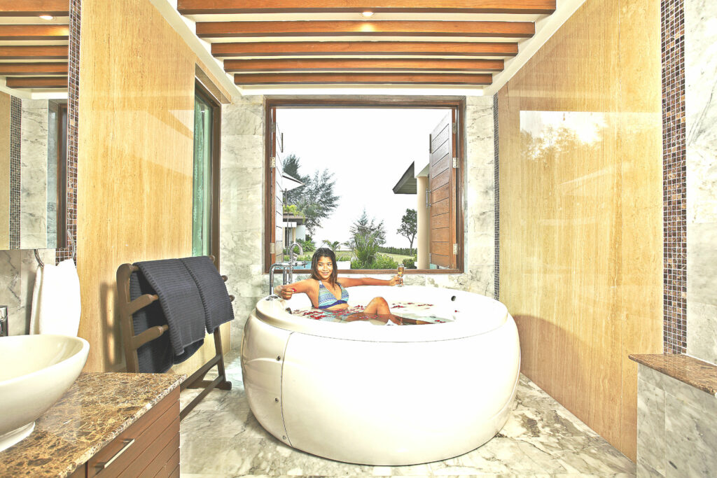 Relaxing in a jacuzzi at a private beachfront villa on Koh Kho Khao Island