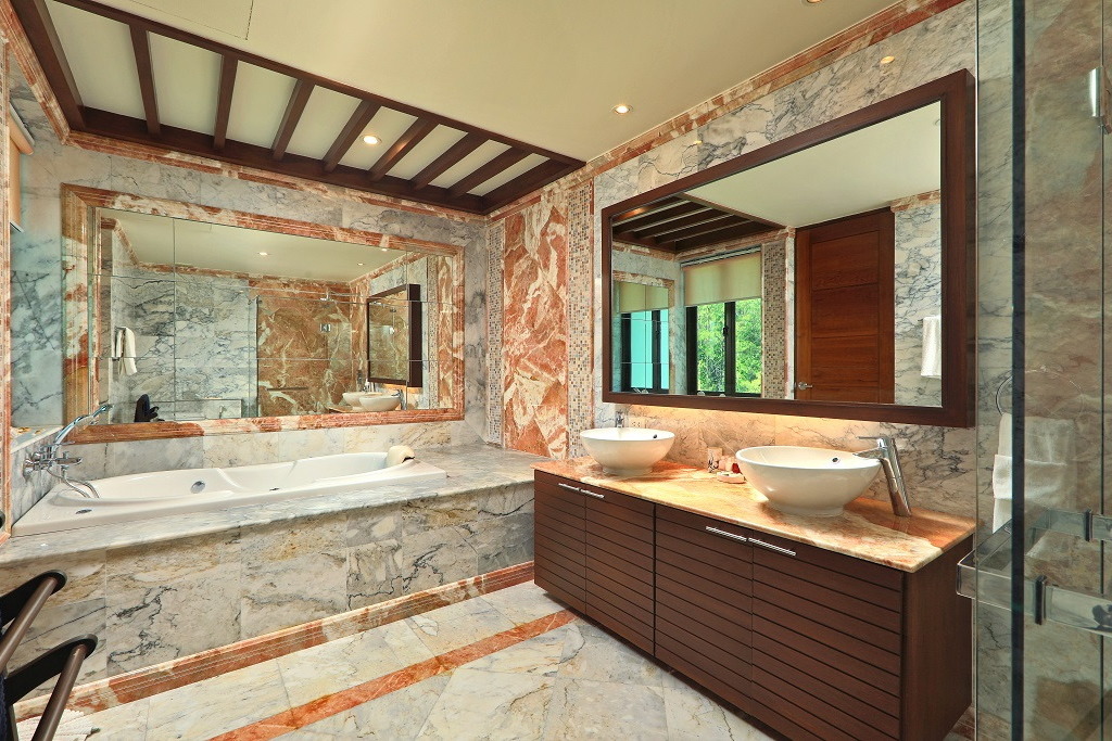 Ensuite bathrooms equipped with jacuzzi tubs, spacious showers and double sinks at our private pool villa